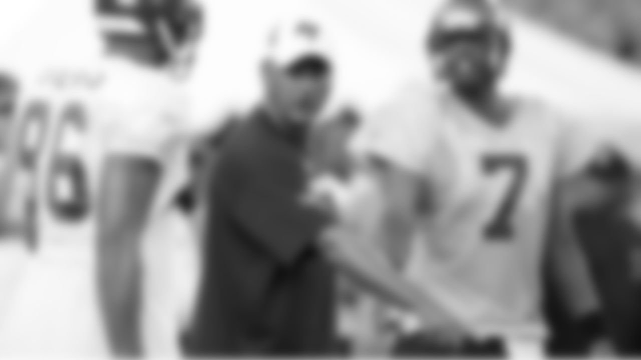 Offensive Coordinator Jeff Jagodzinski directs the positioning for the next play
