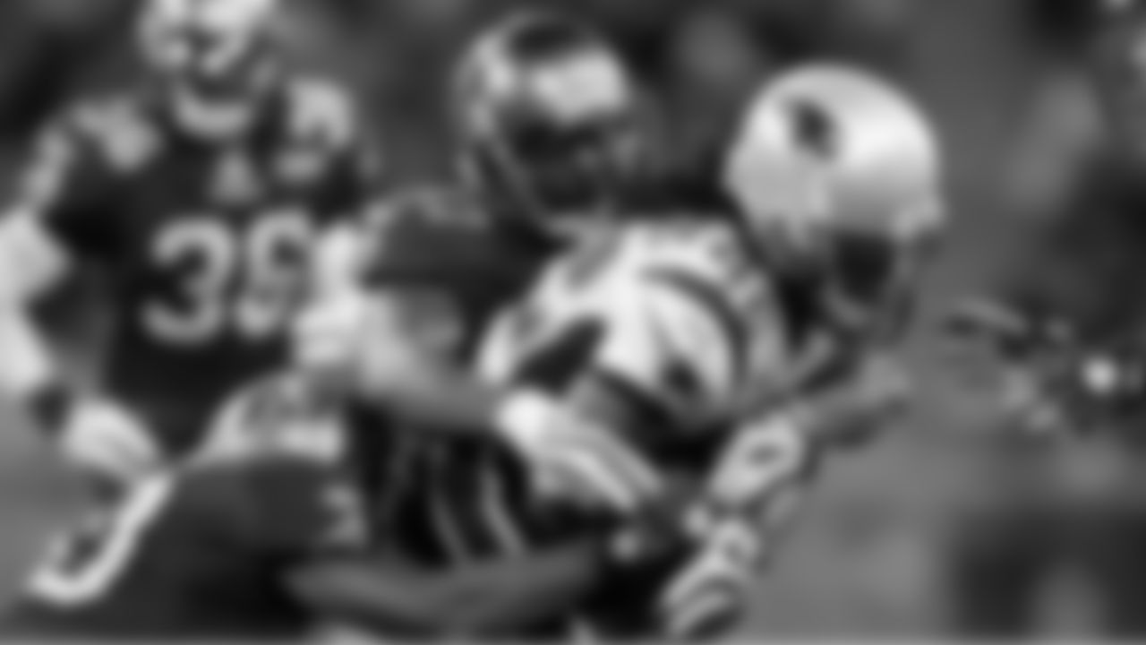97 DE Jimmy Wilkerson brings down the ball carrier