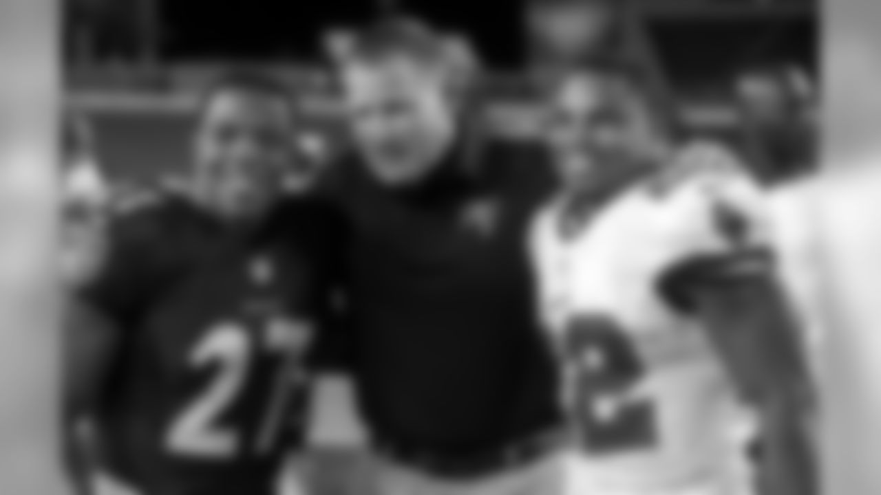Head coach Greg Schiano poses for photos with his former Rutgers, now Baltimore Ravens running back Ray Rice, and his second-year Buccaneer star running back Doug Martin.