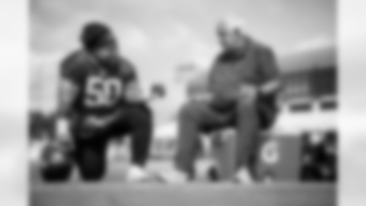 TAMPA, FL - September 15, 2022 - Defensive Tackle Vita Vea #50 of the Tampa Bay Buccaneers and Coach Tom Moore during practice at AdventHealth Training Center. Photo By Tori Richman/Tampa Bay Buccaneers