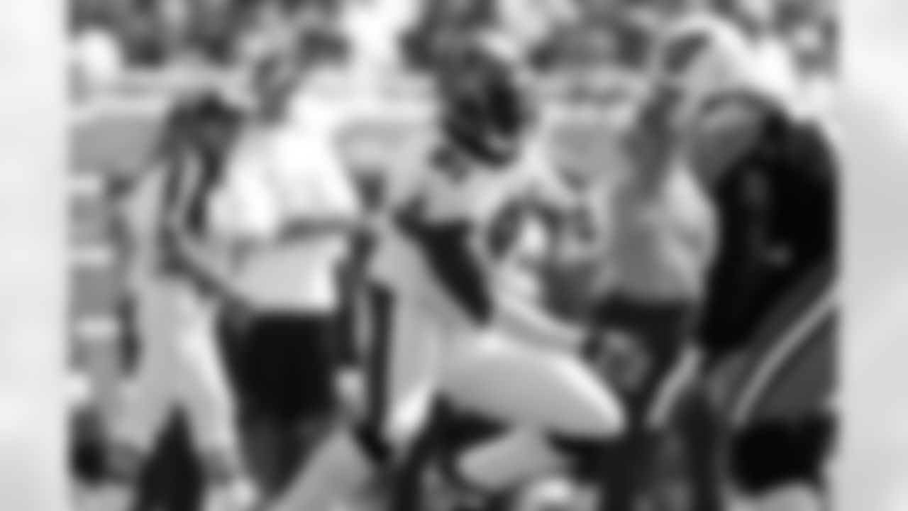 91 Greg White works his way around a Tennessee defender