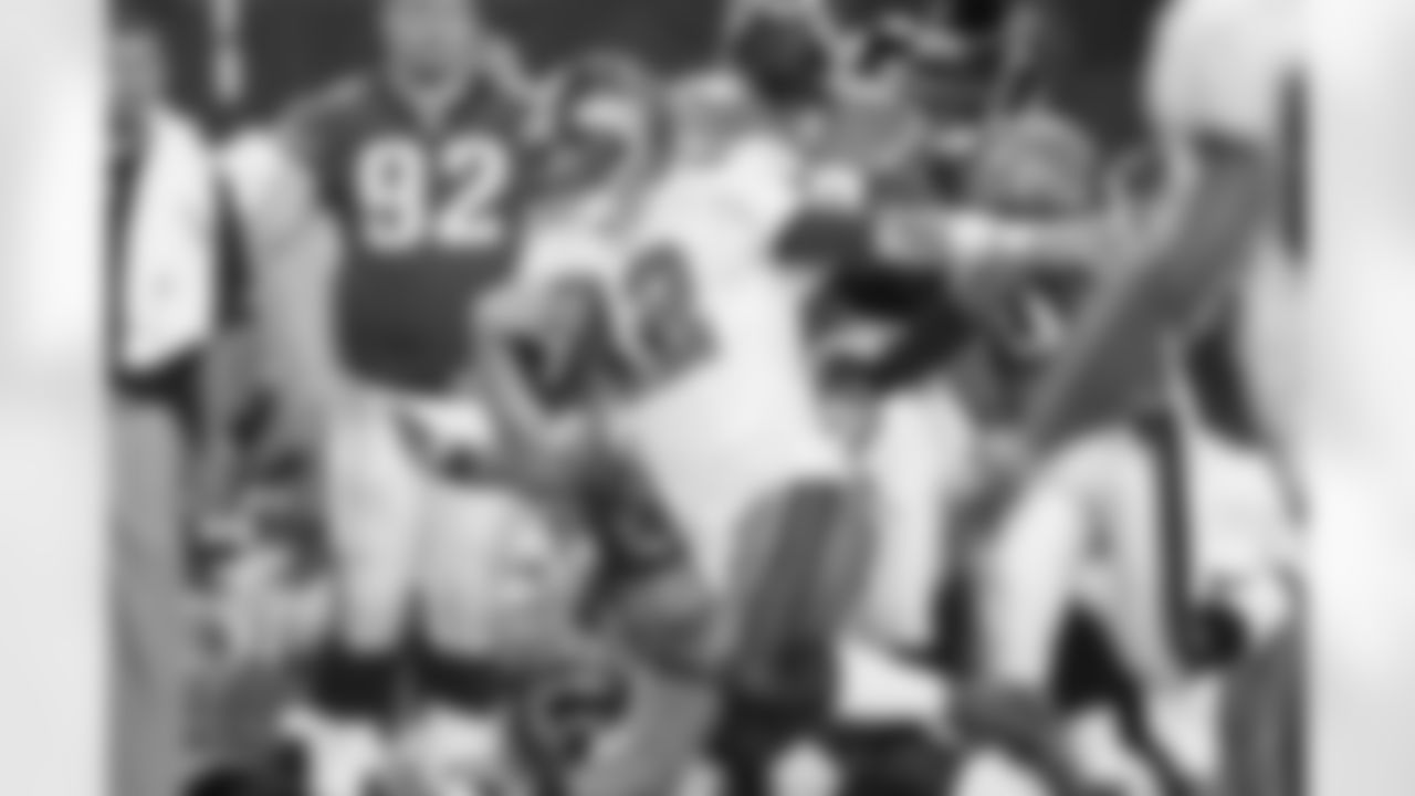 12 QB Luke McCown dodges tackles to gain extra yardage