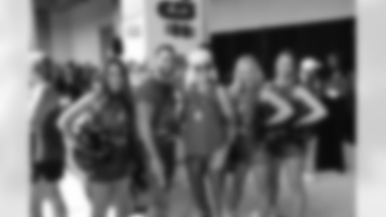 TAMPA, FL - October 10, 2021 - Fans pose with Tampa Bay Buccaneers Cheerleaders at the Women of Red tailgate before the game between the Miami Dolphins and Tampa Bay Buccaneers at Raymond James Stadium. The Buccaneers won the game, 45-17. Photo By Preston Mack/Tampa Bay Buccaneers