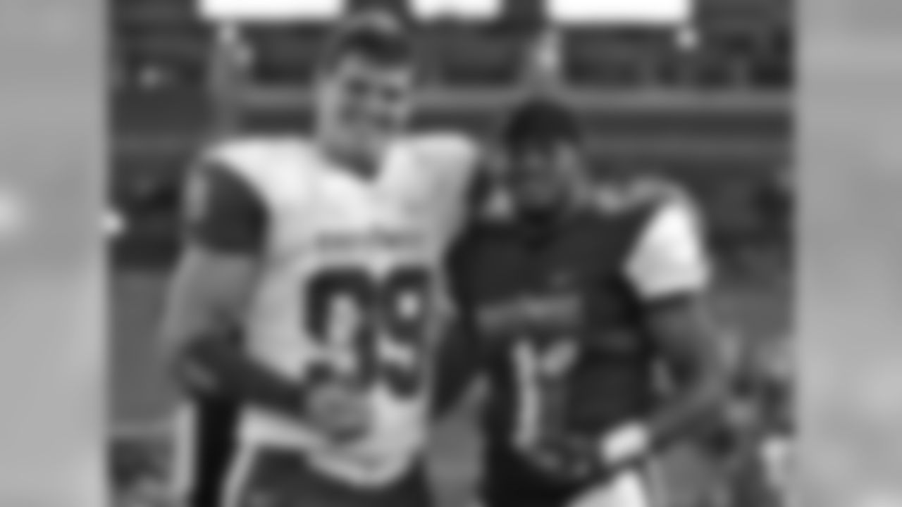 East defensive end Trey Hendrickson, (99), of Florida Atlantic, and West running back Eli McGuire, (1) of Louisiana-Lafayette, pose with their trophies after being named MVP's of the East West Shrine football game Saturday, Jan. 21, 2017, in St. Petersburg, Fla. The West won the game 10-3. (AP Photo/Chris O'Meara)