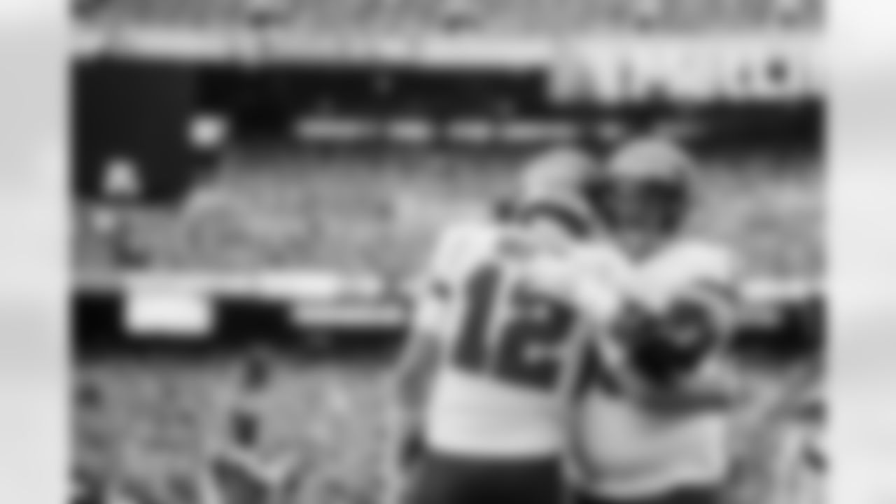 EAST RUTHERFORD, NJ - JANUARY 02, 2022 - Quarterback Tom Brady #12 and Center Ryan Jensen #66 of the Tampa Bay Buccaneers before the game between the Tampa Bay Buccaneers and New York Jets at MetLife Stadium. The Buccaneers won the game, 28-24. Photo By Tori Richman/Tampa Bay Buccaneers