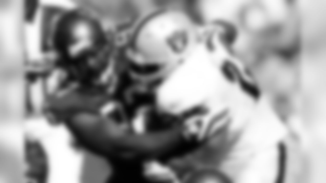 97 DE Jimmy Wilkerson stops the runner in the second quarter