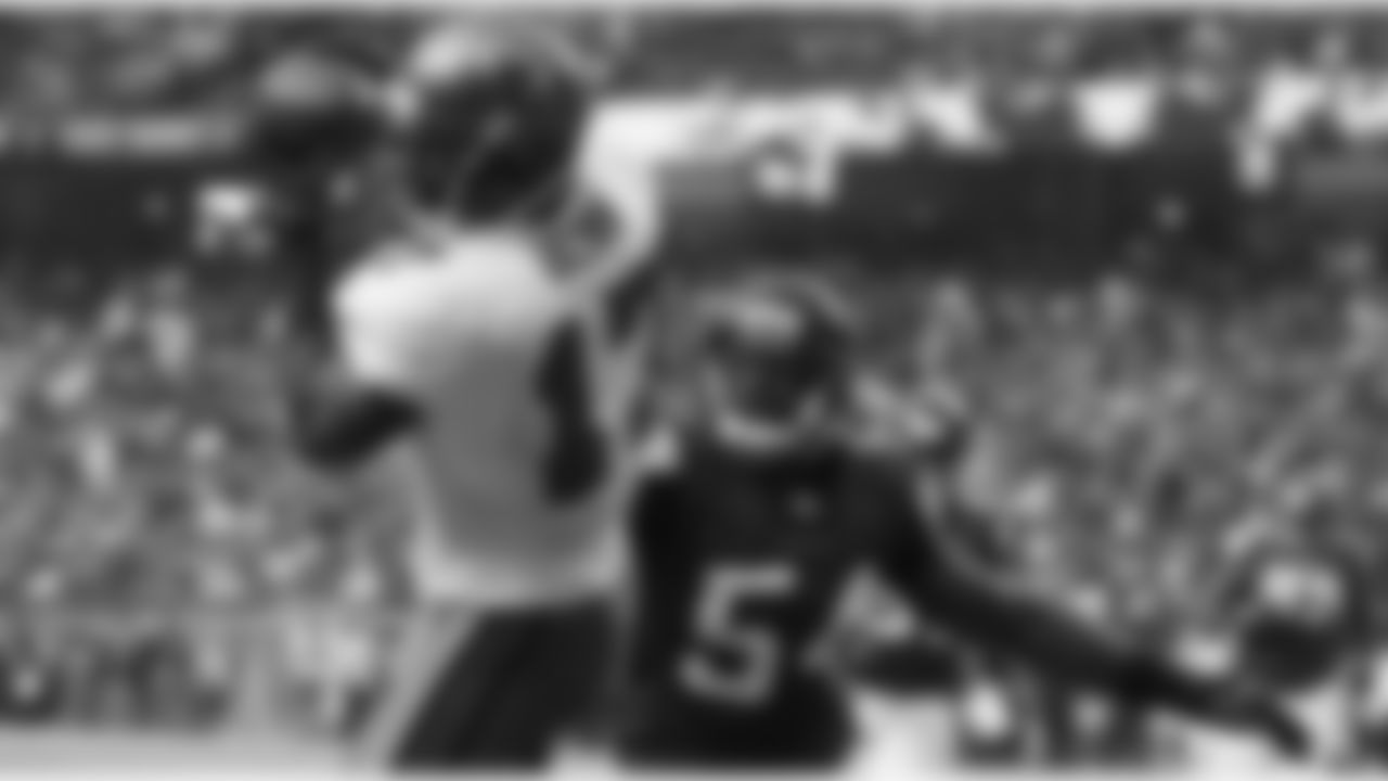17 WR Arrelious Benn pulls in a touchdown catch over coverage