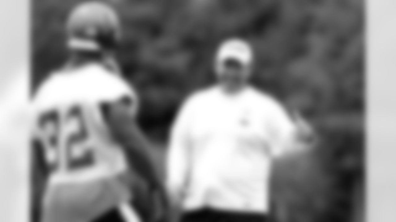 Running Backs Coach Art Valero gives some fine-tuning of a play to RB Michael Pittman