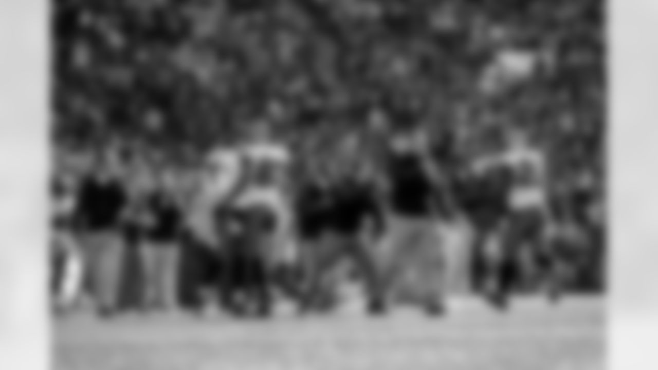 HC Greg Schiano and other coaches celebrate with the offense after a TD