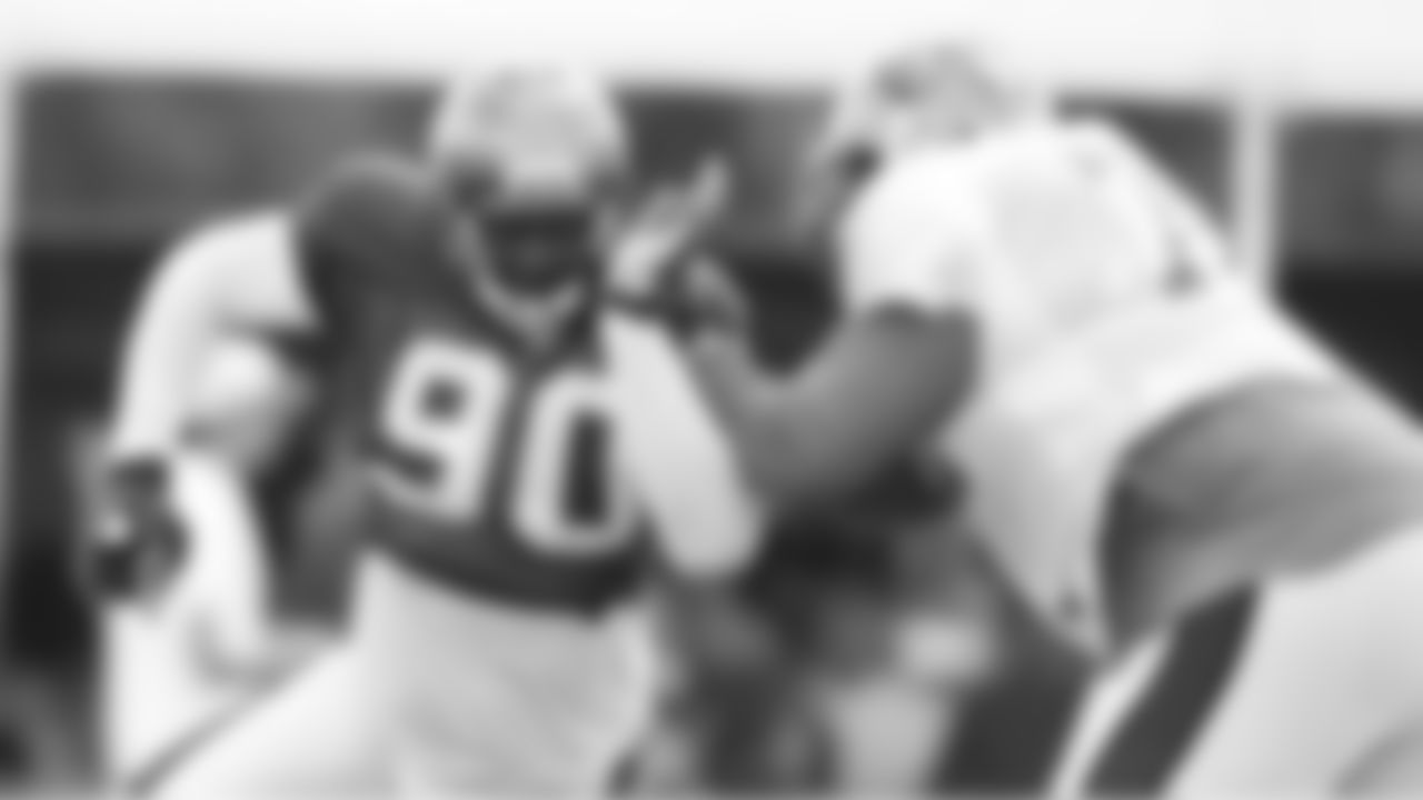DE Gaines Adams minimizes the amount of body he gives the tackle to block