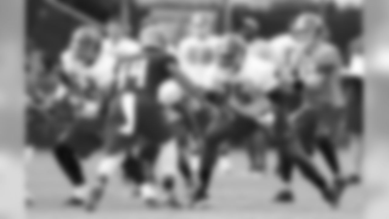 C Evan Dietrich-Smith and G Oniel Cousins #75