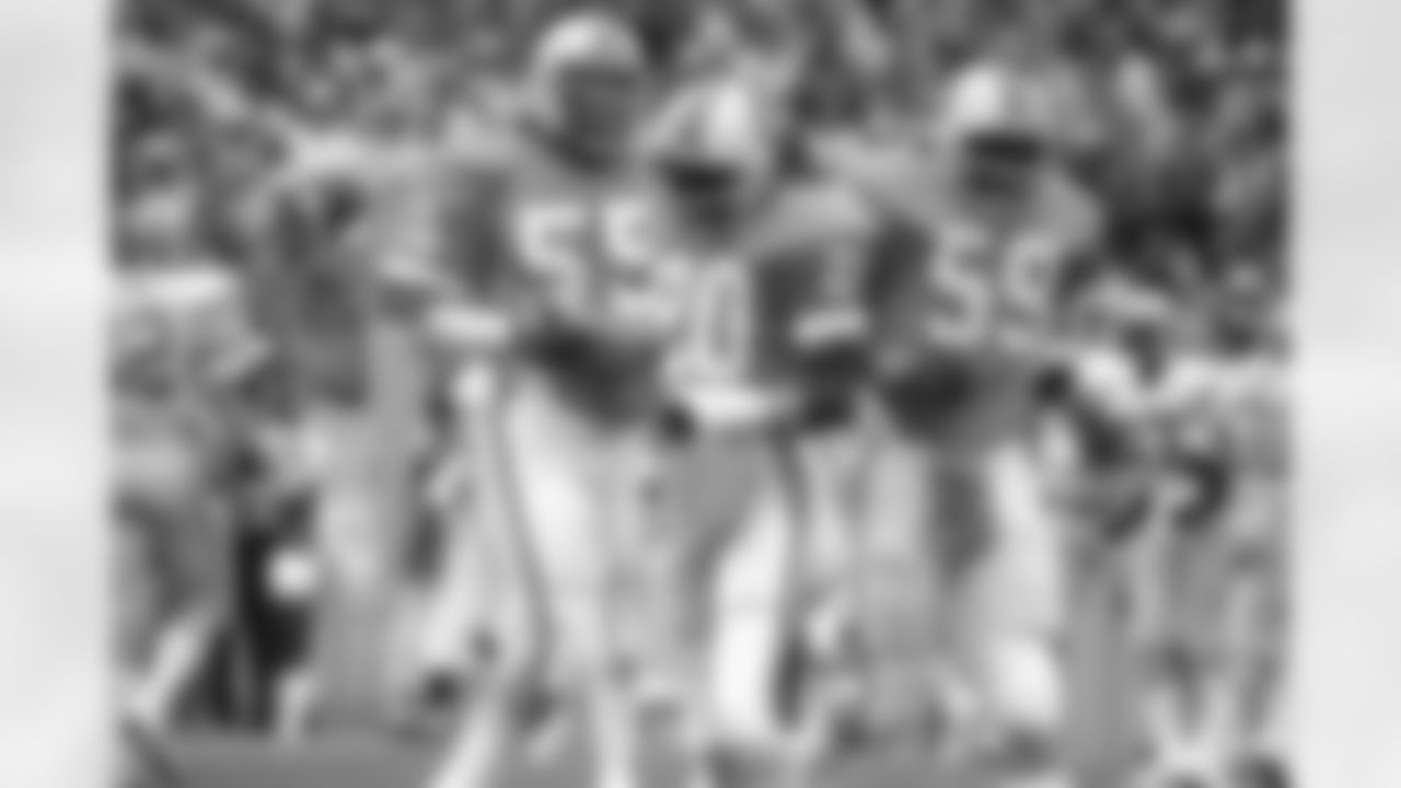 TAMPA, FL - NOVEMBER 23: Safety Neal Colzie #20, Linebacker Aaron Brown #55 and Linebacker Andy Hawkins #59 of the Tampa Bay Buccaneers celebrate against the Detroit Lions at Tampa Stadium on November 23, 1980 in Tampa, Florida. The Buccaneers lost 10-24. (photo by Allen's Studio/Tampa Bay Buccaneers)