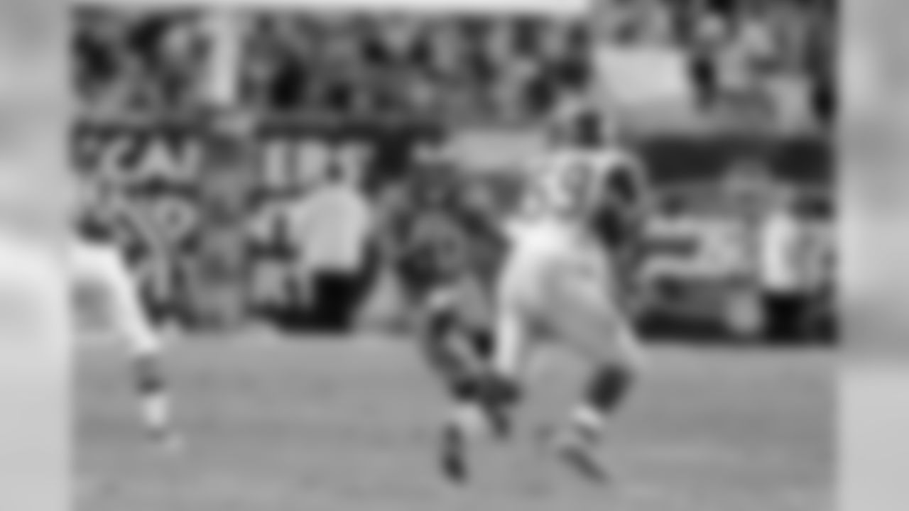 December 18, 2000 - Warrick Dunn is stopped in the backfield and pitches it back to Shaun King who changed directions and picked up 15. It was a key play in the game-winning drive against the St. Louis Rams.