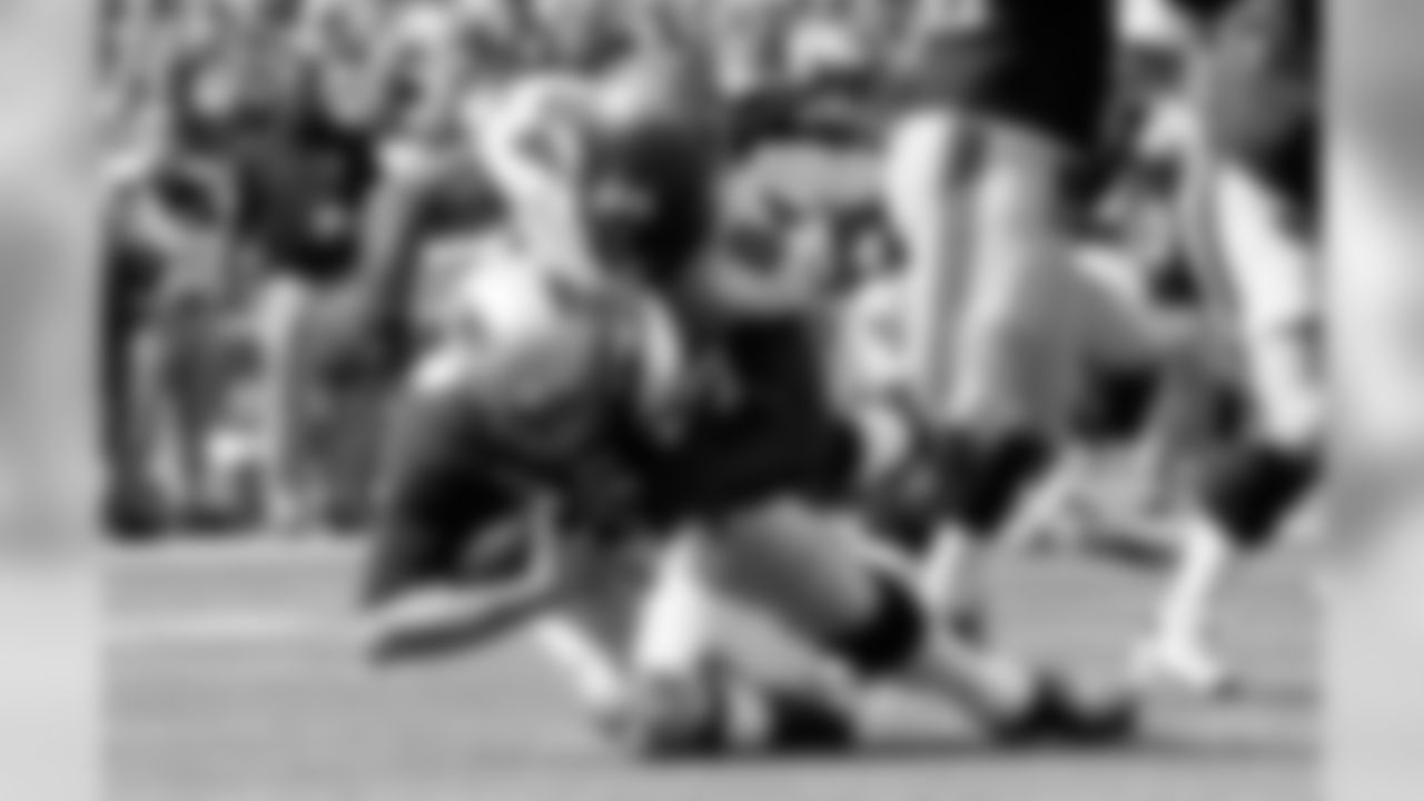 DE Adrian Clayborn takes Tom Brady to the ground during first quarter action, the 11th Buccaneer sack of the season.