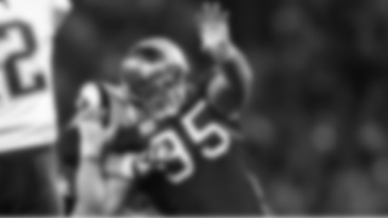 95 DT Chris Hovan powers around an offensive lineman to get to the quarterback
