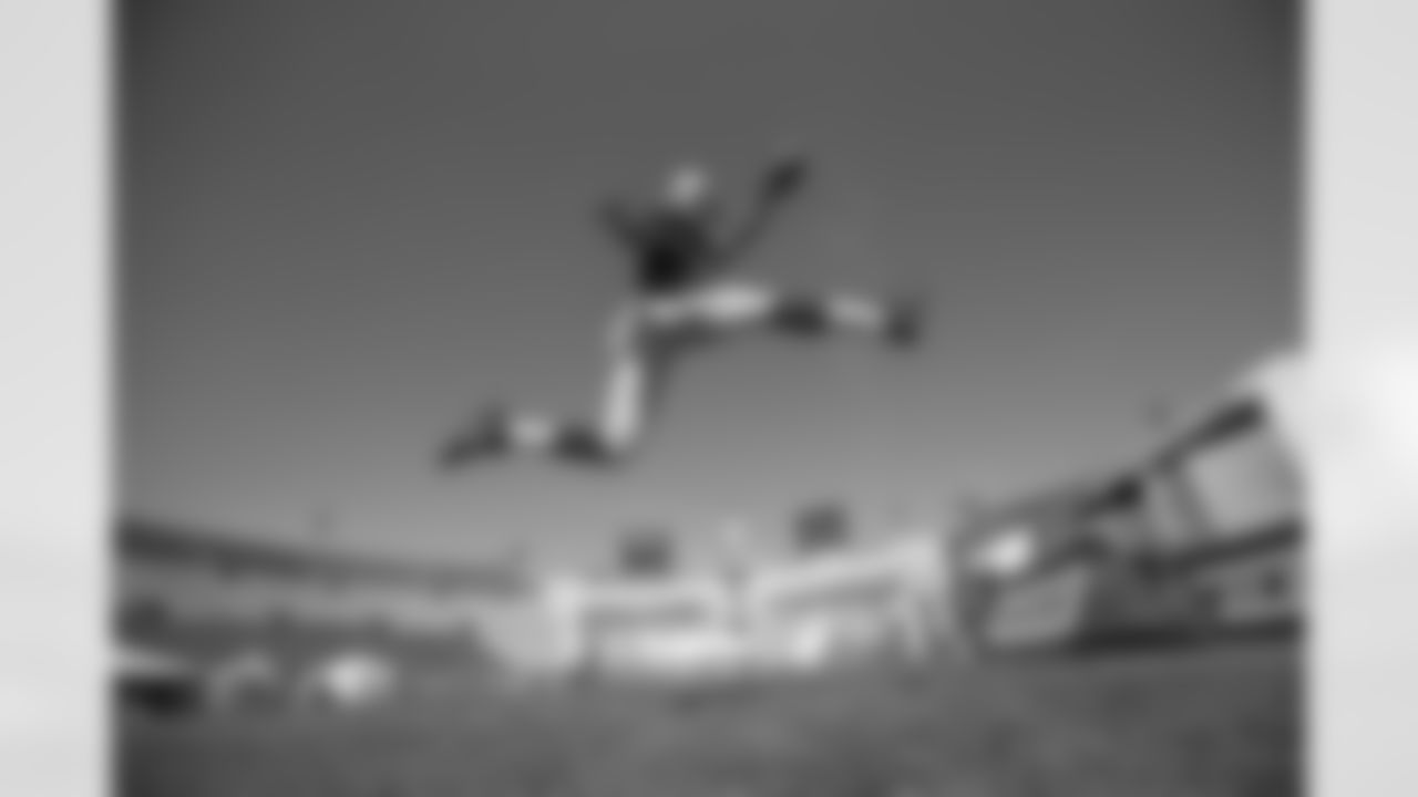 Arizona Cardinals running back David Johnson leaps in the air during a photo shoot during the NFLPA Rookie Premiere.