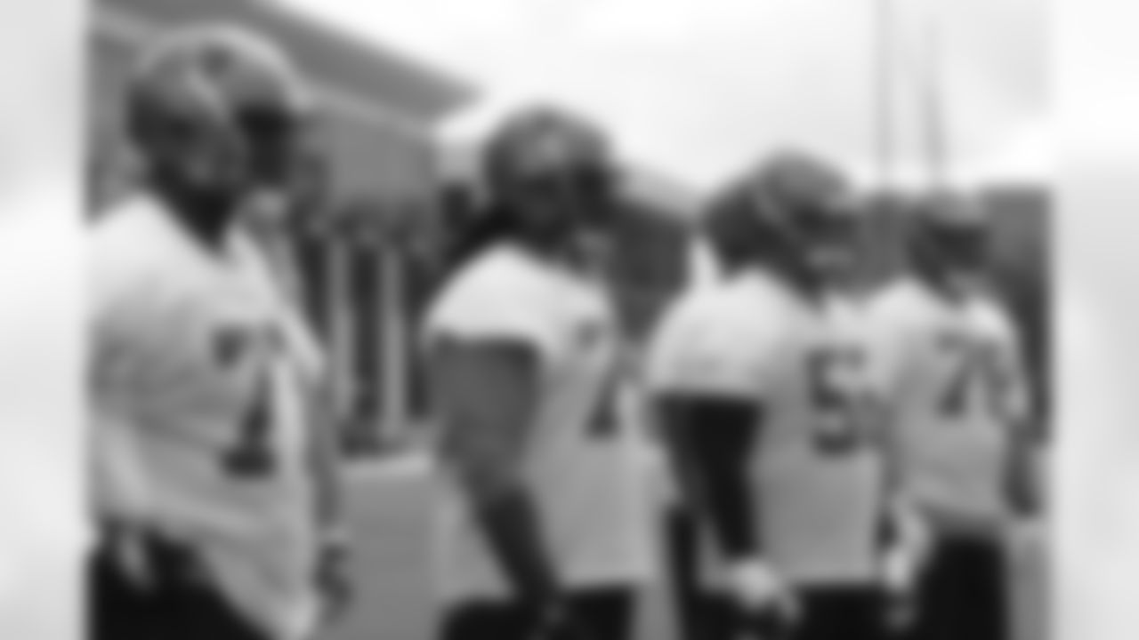 The offensive line waits for its chance to get in on the action