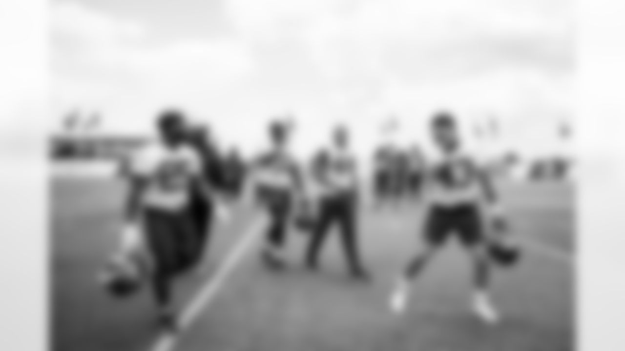 TAMPA, FL - May 13, 2023 - Running Back Mekhi Sargent #25, Running Backs Coach Skip Pete, Running Back Ikechukwu Irabor #37, Running Back Sean Tucker #44, and Running Back Ronnie Brown #43 of the Tampa Bay Buccaneers during 2023 Rookie Mini Camp at AdventHealth Training Center. Photo By Kyle Zedaker/Tampa Bay Buccaneers