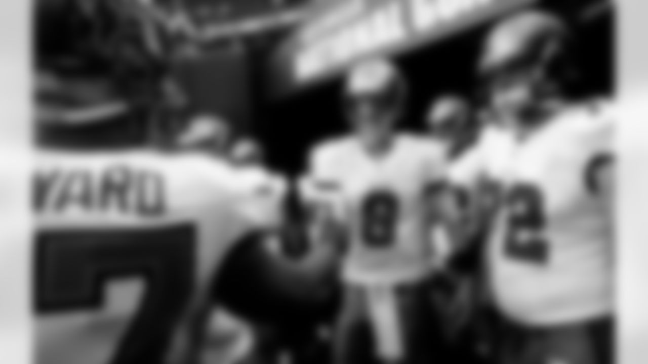 QB Mike Glennon and his teammates head out to the field