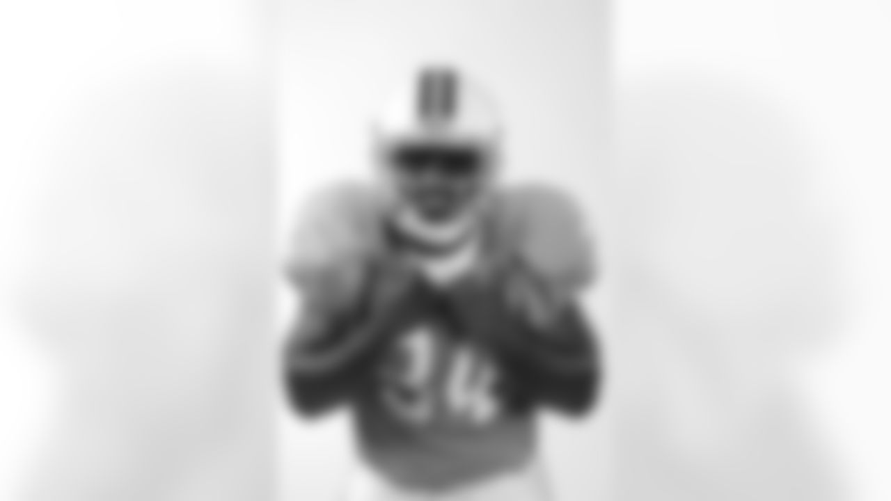 Runningback Earnest Graham #34 of the Tampa Bay Buccaneers in a 1976 Buccaneers throwback jersey during a studio photo shoot at One Buccaneer Place in Tampa, Florida.