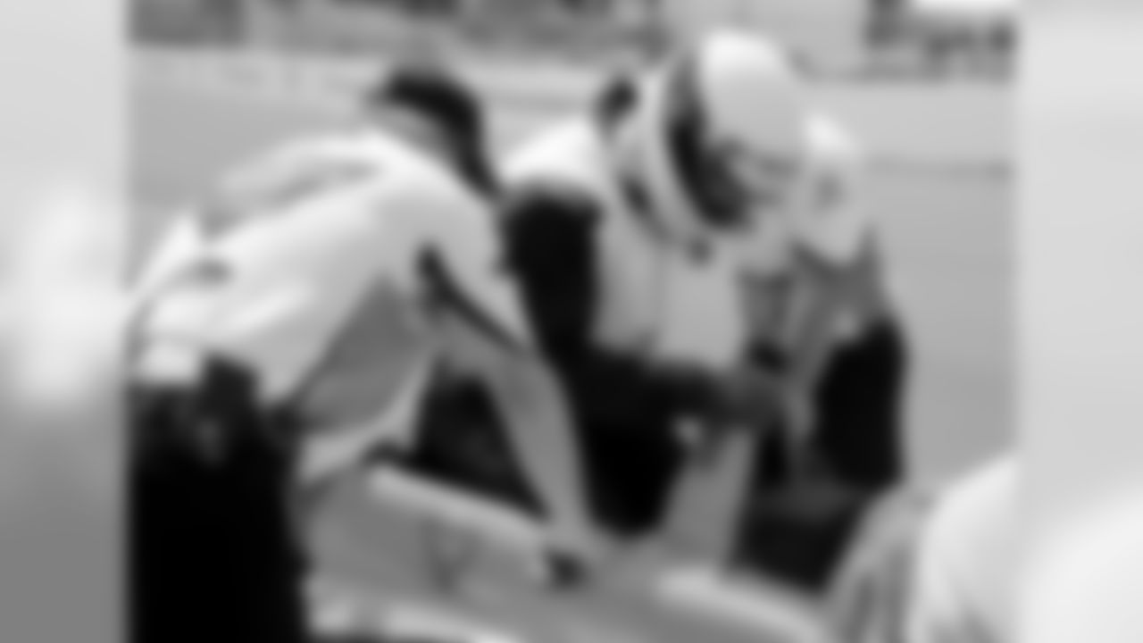 TE Austin Seferian-Jenkins gets into Mario Andretti's car.
