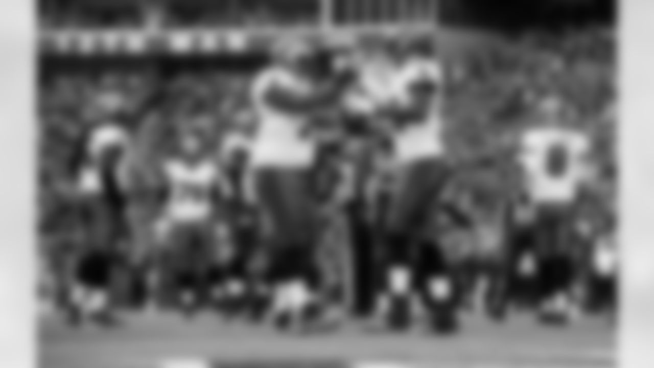 T Donald Penn celebrates with TE Tim Wright after his TD catch