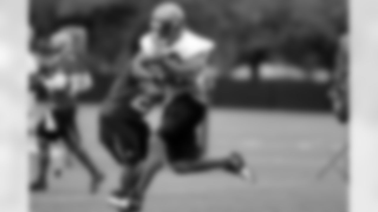 RB Michael Pittman takes a shot from the side while airborne