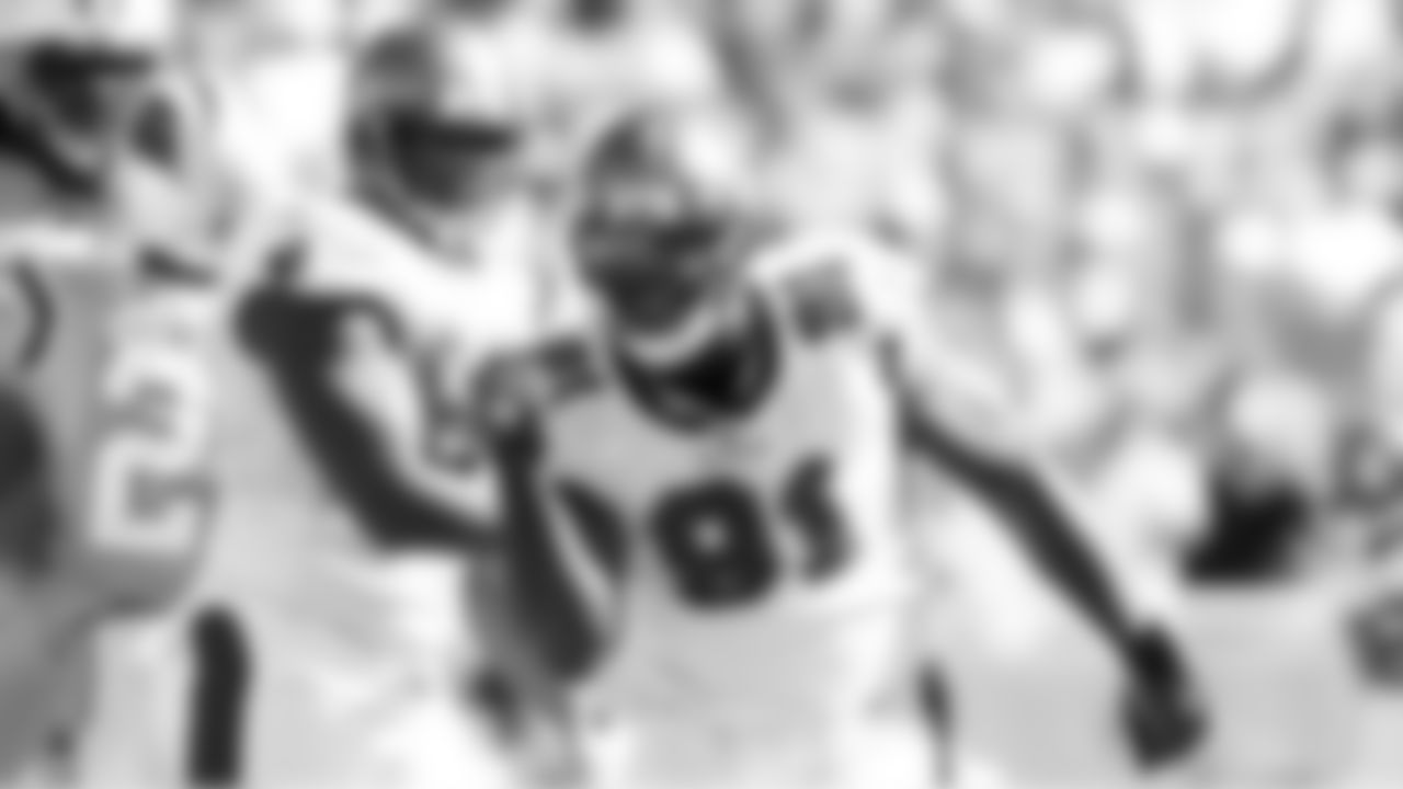 91 DE Stylez G. White celebrates his sack in the game