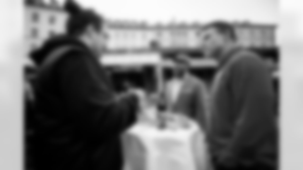 MUNICH, DE - November 12, 2022 - Buccaneers Legends Mike Alstott and Ronde Barber tour the Viktualienmarkt. Photo By Tori Richman/Tampa Bay Buccaneers