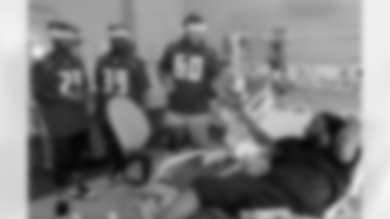 29 DB Ryan Smith, #39 S Isaiah Johnson, and #60 OT Kyler Kerbyson