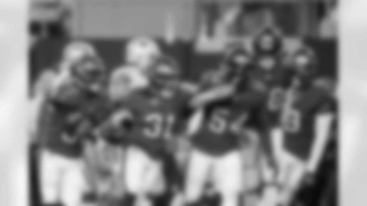 ARLINGTON, TX - September 11, 2022 - Safety Antoine Winfield Jr. #31 celebrates with Safety Mike Edwards #32, Inside Linebacker Lavonte David #54, Outside Linebacker Shaquil Barrett #58, and Outside Linebacker Joe Tryon-Shoyinka #9 of the Tampa Bay Buccaneers during the game between the Tampa Bay Buccaneers and Dallas Cowboys at AT&T Stadium. The Buccaneers won the game, 19-3. Photo By Kyle Zedaker/Tampa Bay Buccaneers