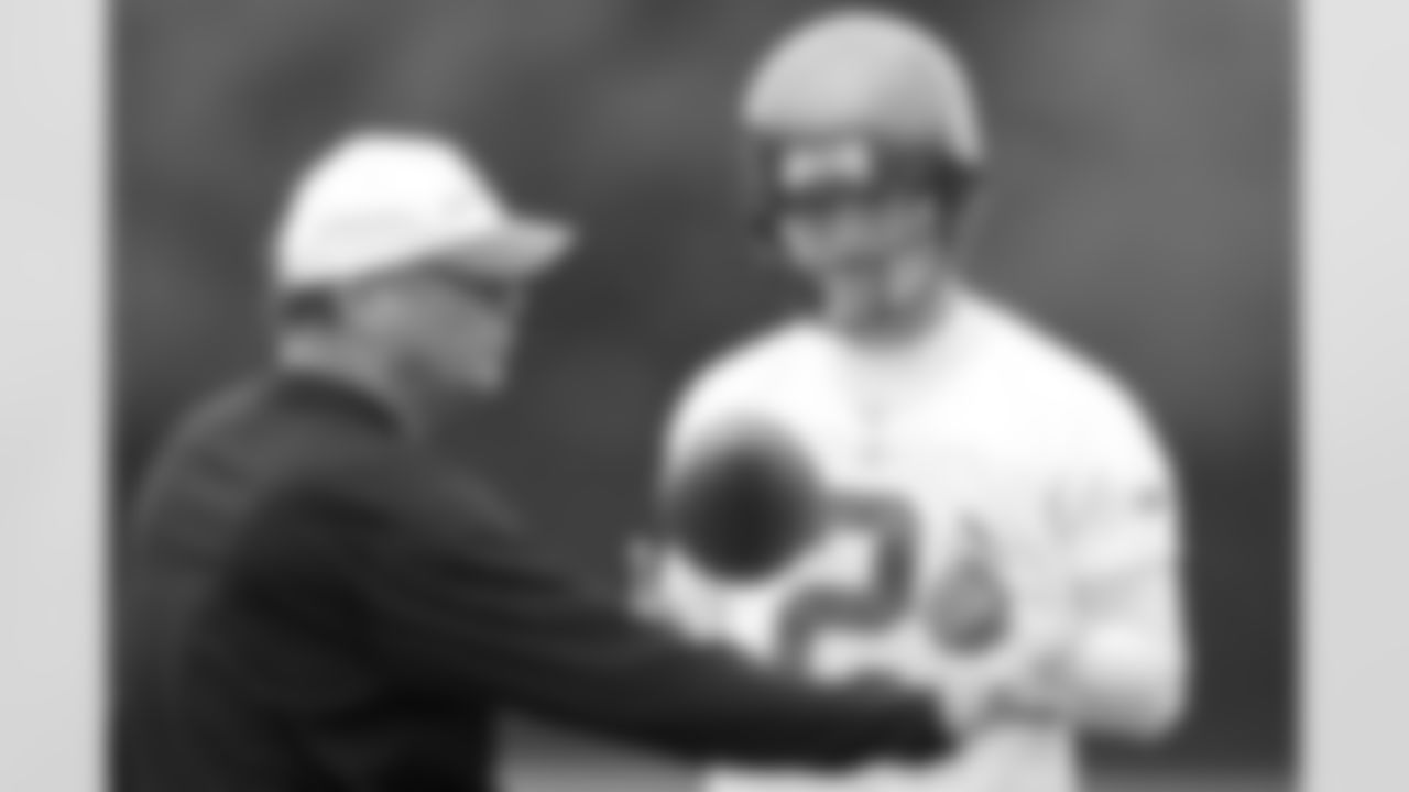 QB Chris Simms listens to his position coach, Paul Hackett