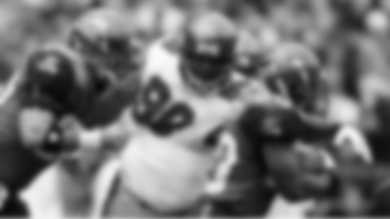 98 DT Ryan Sims gets penetration and strikes the ball carrier