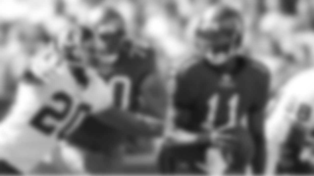 11 QB Josh Johnson scrambles out of the pocket to find extra yardage