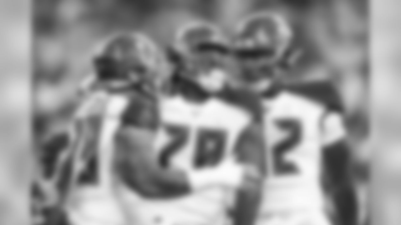 OLB Patrick O'Connor, No. 79, DL Jeremiah Ledbetter, No. 78 and DL Will Gholston, No. 92