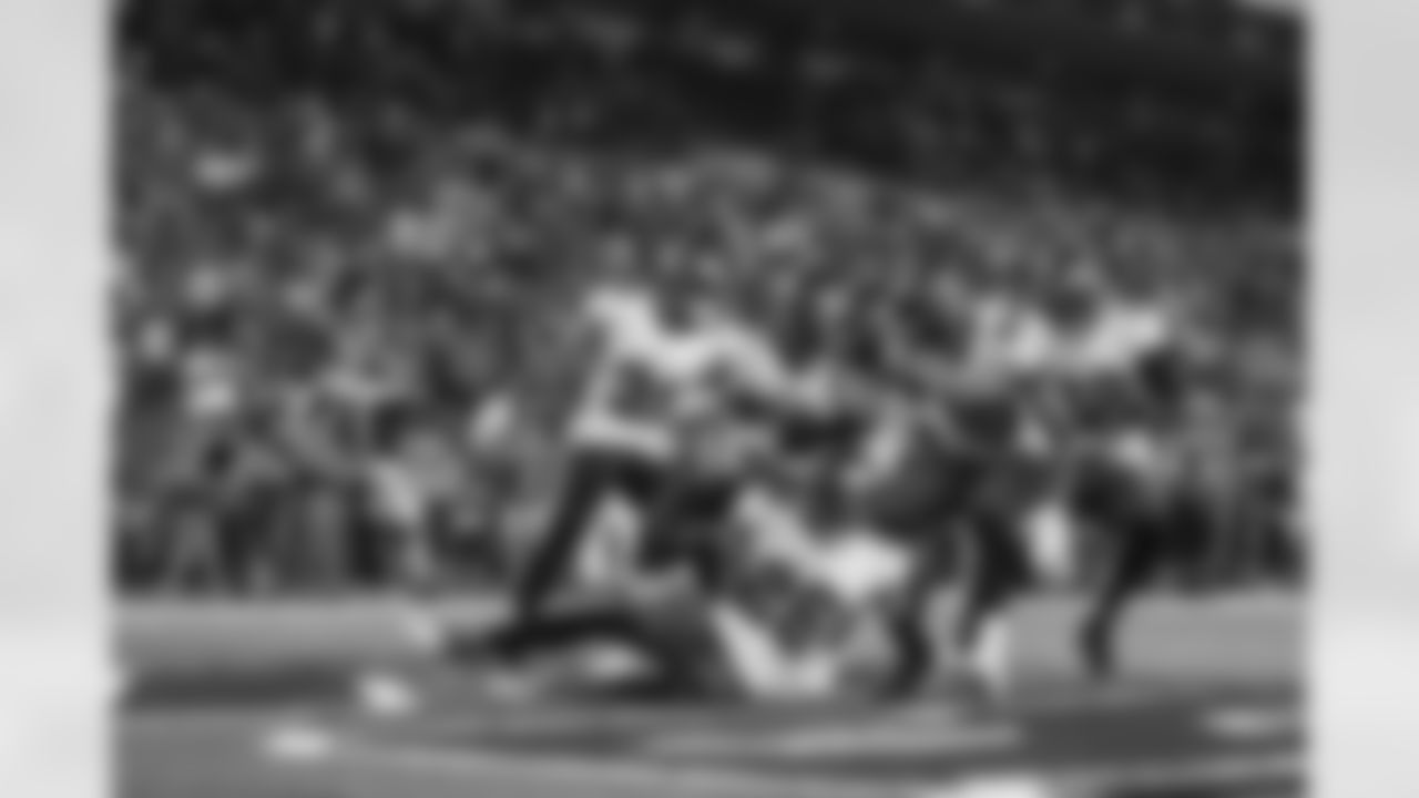 TAMPA, FL - January 09, 2022 - Safety Andrew Adams #26 celebrates a turnover with Safety Antoine Winfield Jr. #31, Defensive Tackle Rakeem Nunez-Roches #56, Cornerback Dee Delaney #30, and Cornerback Pierre Desir #29, and Safety Mike Edwards #32 of the Tampa Bay Buccaneers during the game between the Carolina Panthers and Tampa Bay Buccaneers at Raymond James Stadium. The Buccaneers won the game, 41-17. Photo By Kyle Zedaker/Tampa Bay Buccaneers