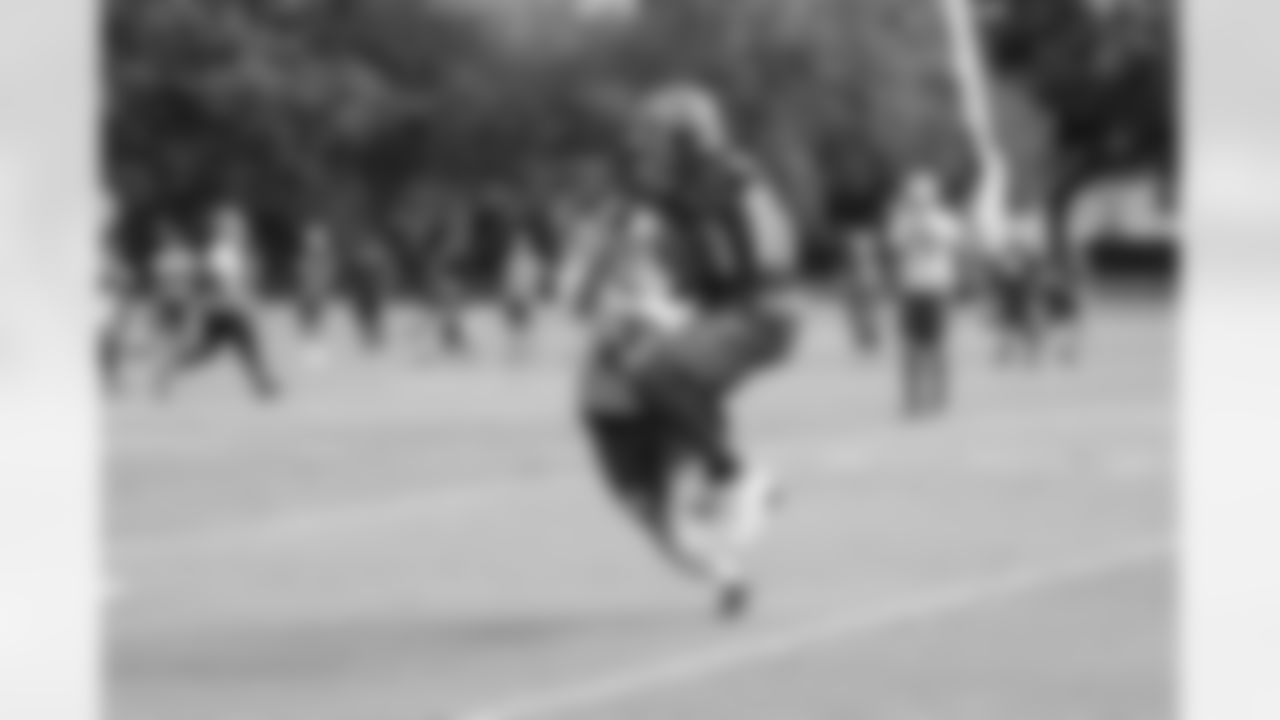 23 S Chris Conte and #16 WR Freddie Martino