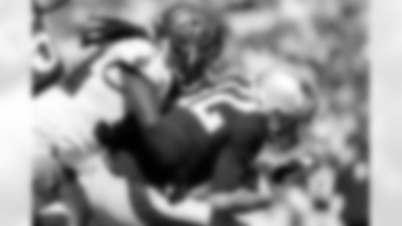 Buccaneer DE Adrian Clayborn breaks through the Patriots offensive line before taking QB Tom Brady to the ground for the second Buccaneer sack of the day.