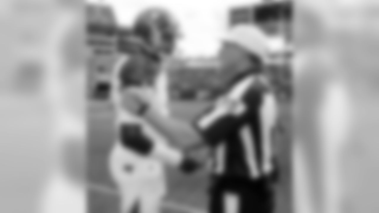 Jameis Winston meets with referee before Titans game.