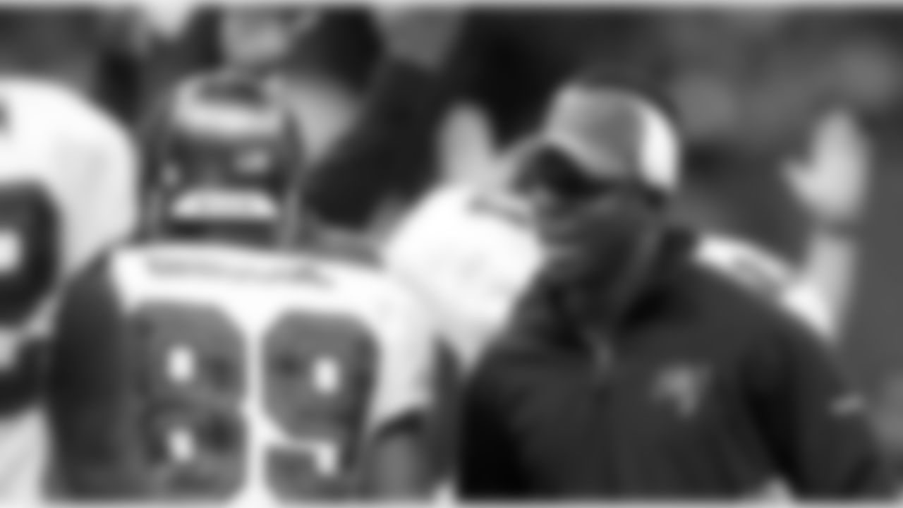 Head Coach Raheem Morris congratulates rookie receiver Desmond Briscoe for the touchdown
