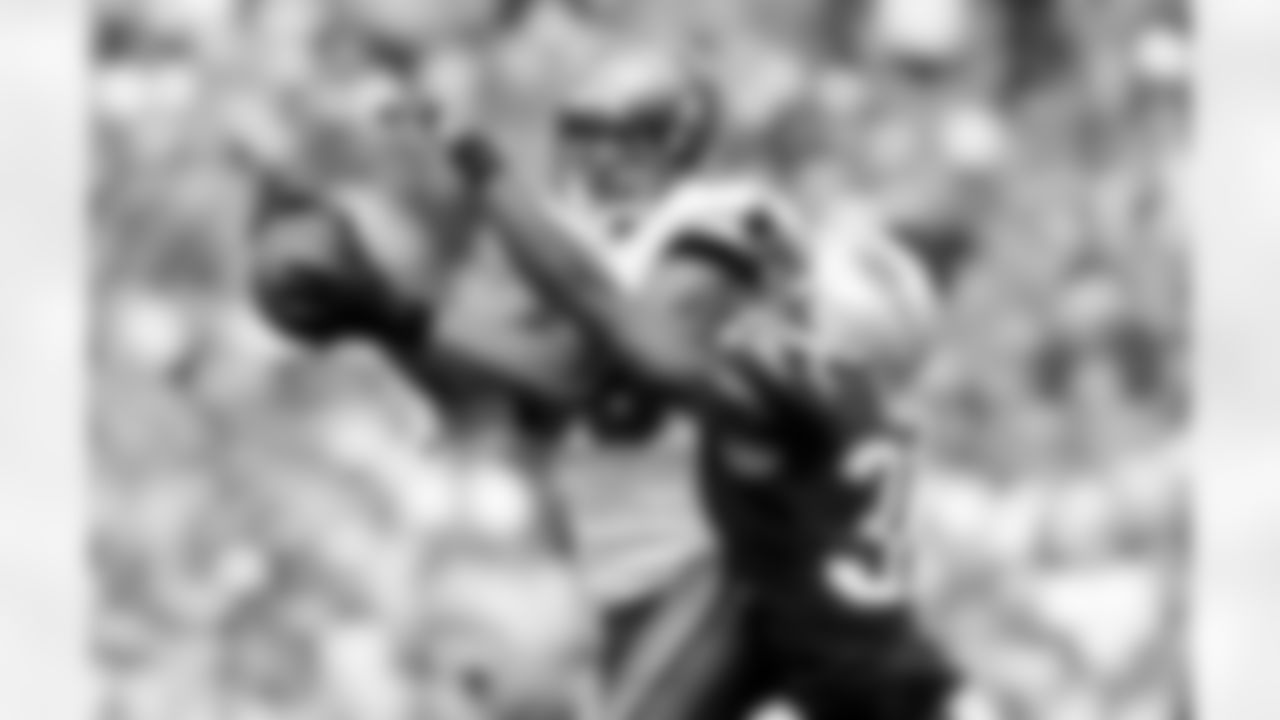 WR Vincent Jackson fights off Patriots CB Aqib Talib for a completion in the first half of action.