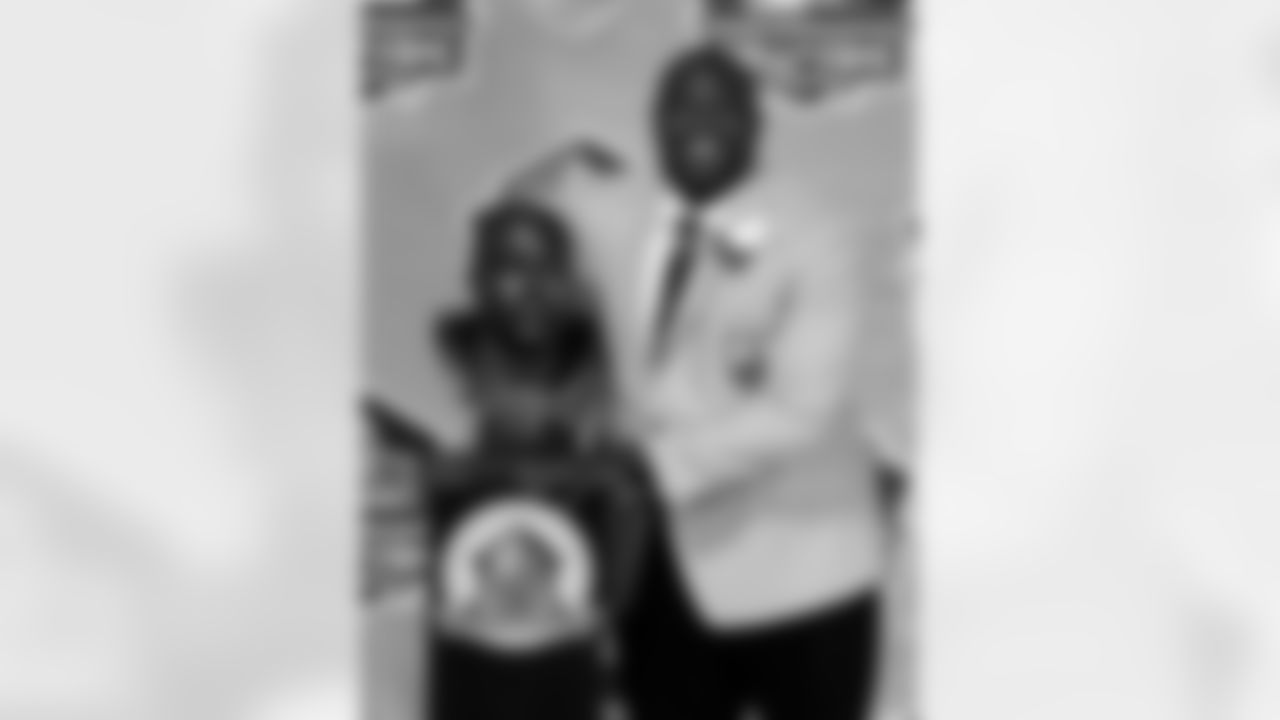 After each enshrinee finished his speech, he was led to a special area behind and to the right of the stage. There, he posed with his new bronze bust for dozens of cameras to get that most iconic of images from the Hall of Fame.