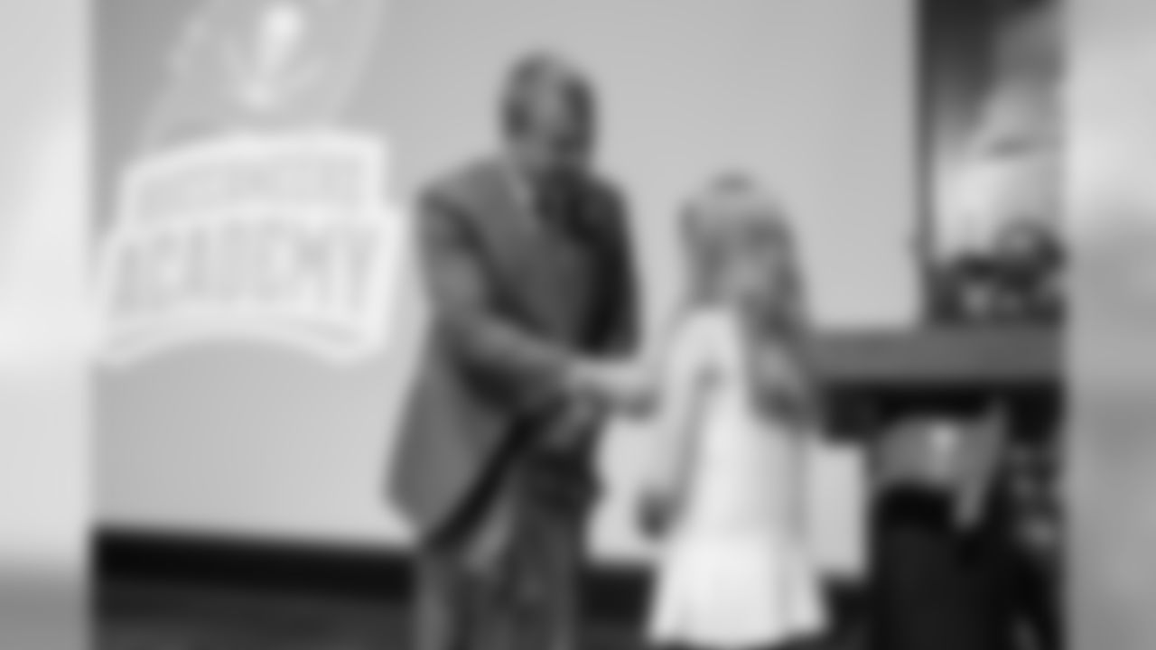 Buccaneers COO Brian Ford and contest winner Olivia Childers