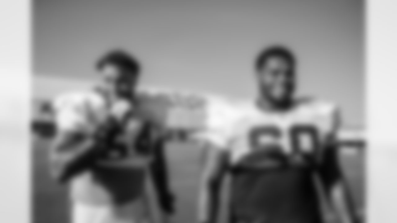 TAMPA, FL - August 01, 2021 - Guard Aaron Stinnie #64 and Guard Nick Leverett #60 of the Tampa Bay Buccaneers during 2021 Training Camp practice at AdventHealth Training Center. Photo By Kyle Zedaker/Tampa Bay Buccaneers