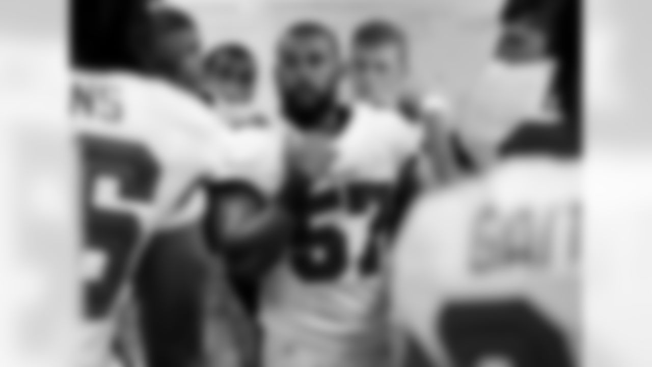 LB Adam Hayward speaks to teammates in the locker room pre-game.
