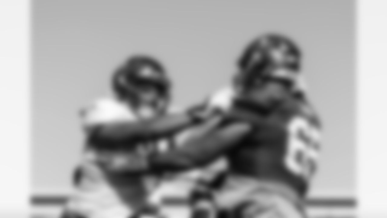 TAMPA, FL - December 01, 2022 - Defensive Lineman Logan Hall #90 and Tackle Dylan Cook #65 of the Tampa Bay Buccaneers during practice at AdventHealth Training Center. Photo By Tori Richman/Tampa Bay Buccaneers