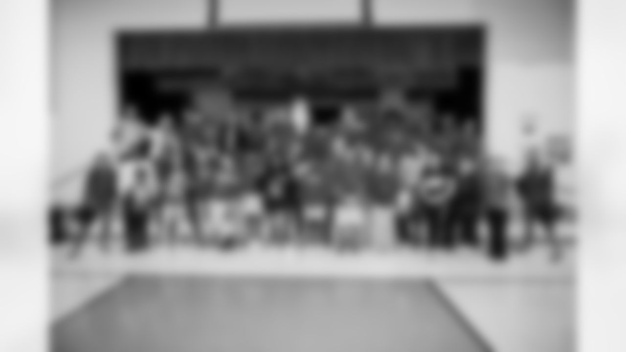TAMPA, FL - December 15, 2022 - Students and staff share food, gifts, and games, during the 2022 Youth Leadership Program holiday party at Young Middle Magnet School. Photo By Kyle Zedaker/Tampa Bay Buccaneers
