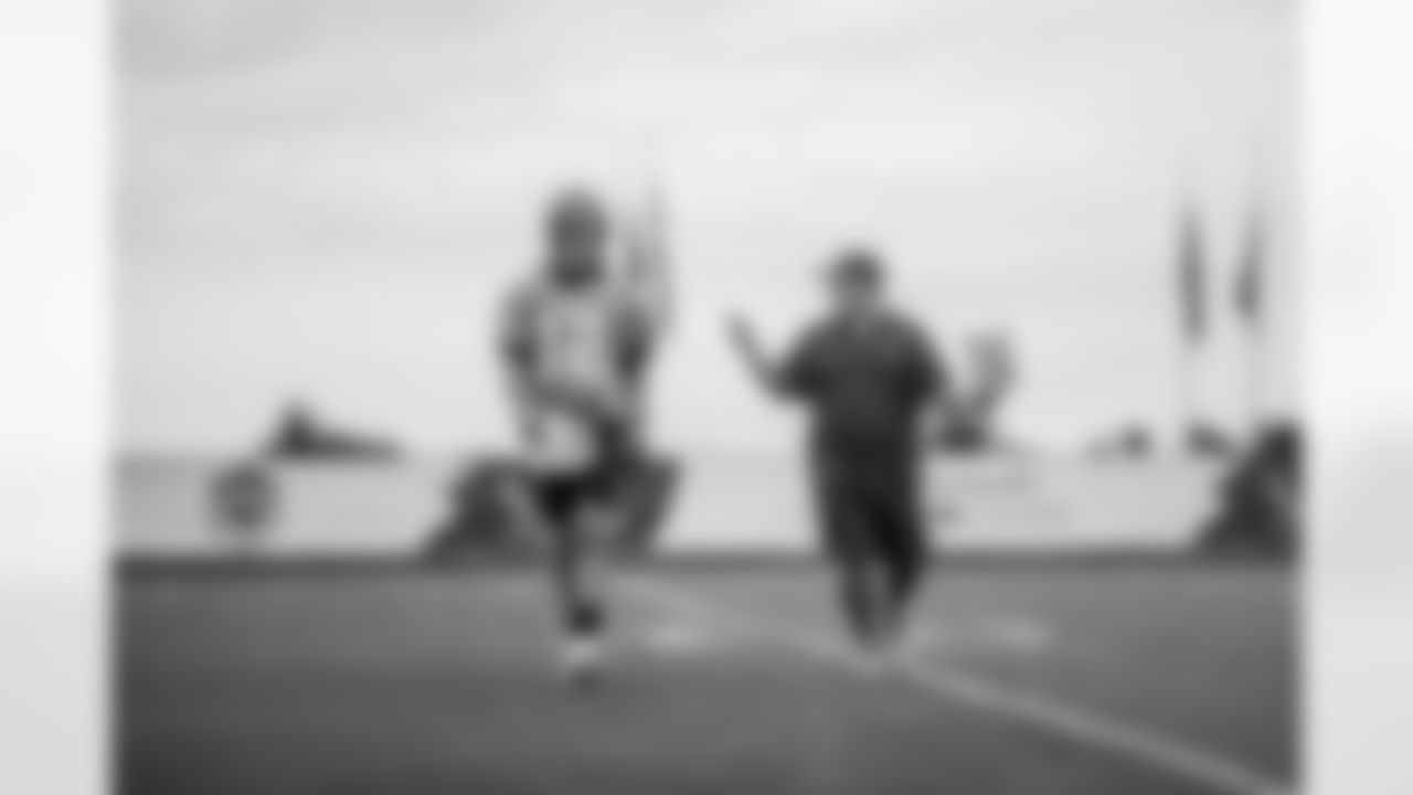 TAMPA, FL - NOVEMBER 18, 2021 - Quarterback Tom Brady #12 and Quarterbacks Coach Clyde Christiansen of the Tampa Bay Buccaneers during practice at AdventHealth Training Center. Photo By Tori Richman/Tampa Bay Buccaneers