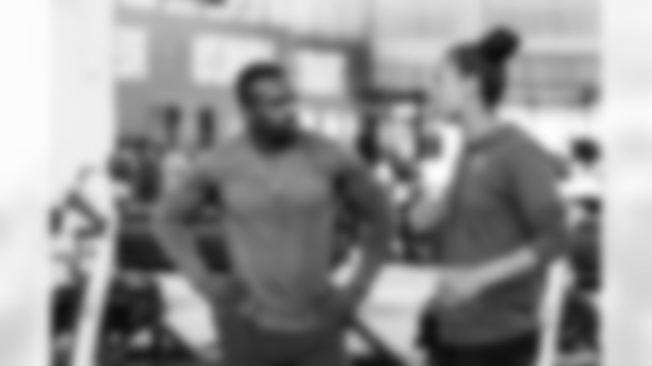 TAMPA, FL - April 26, 2023 - Running back Chase Edmonds of the Tampa Bay Buccaneers and Director of Rehabilitation and Performance Coach Maral Javadifar of the Tampa Bay Buccaneers during Phase 1 of the offseason program at AdventHealth Training Center. Photo By Tori Richman/Tampa Bay Buccaneers