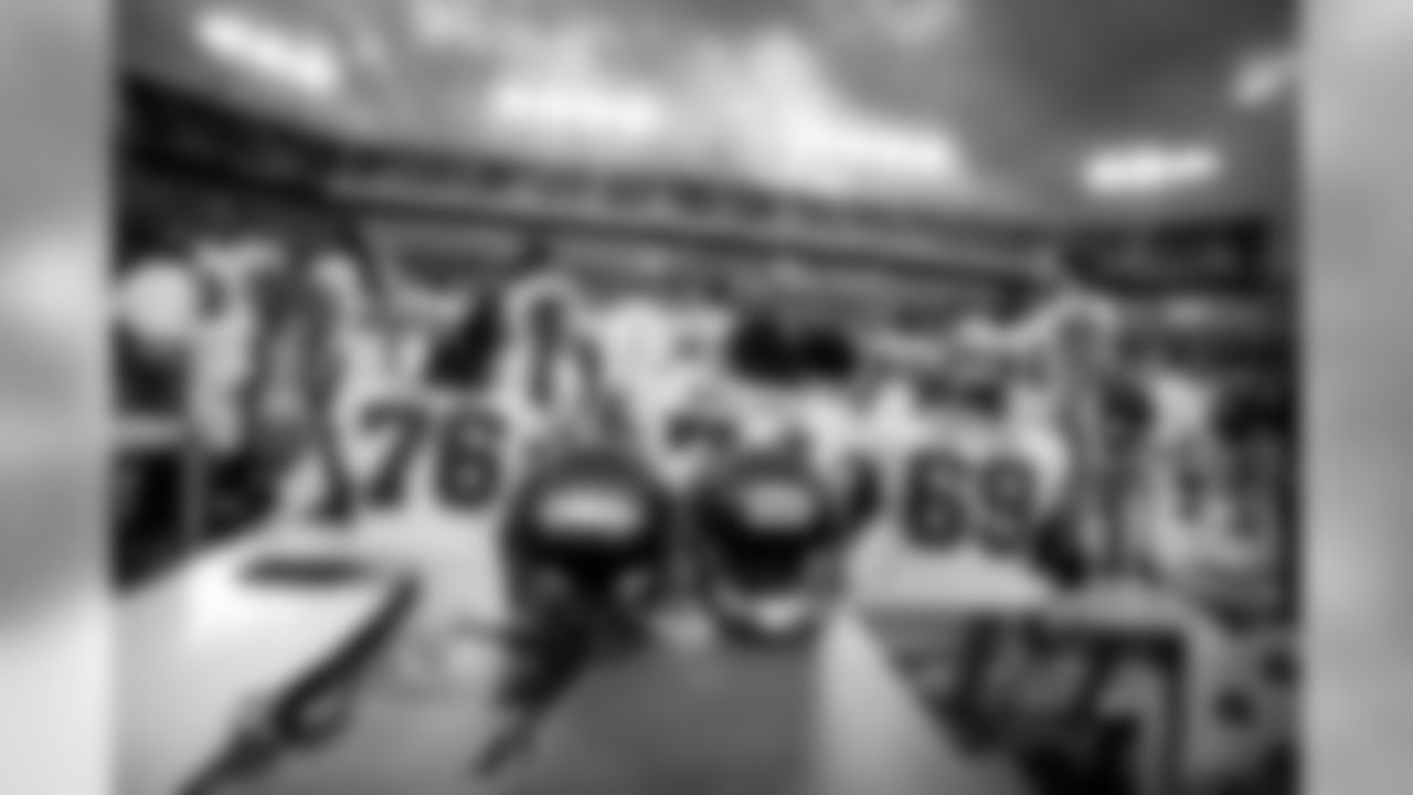 Members of the Buccaneers offensive line take a seat during preseason action.